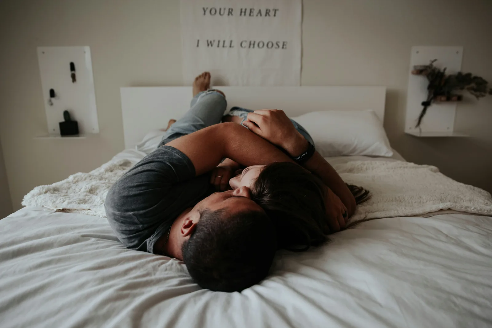 Couple resting together on a bed