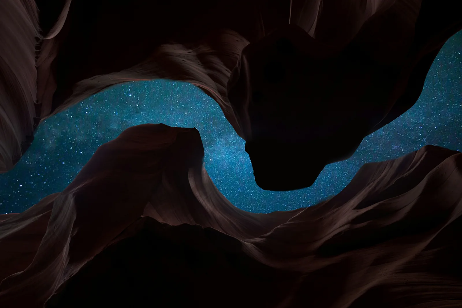 Starry sky viewed through a winding sandstone canyon