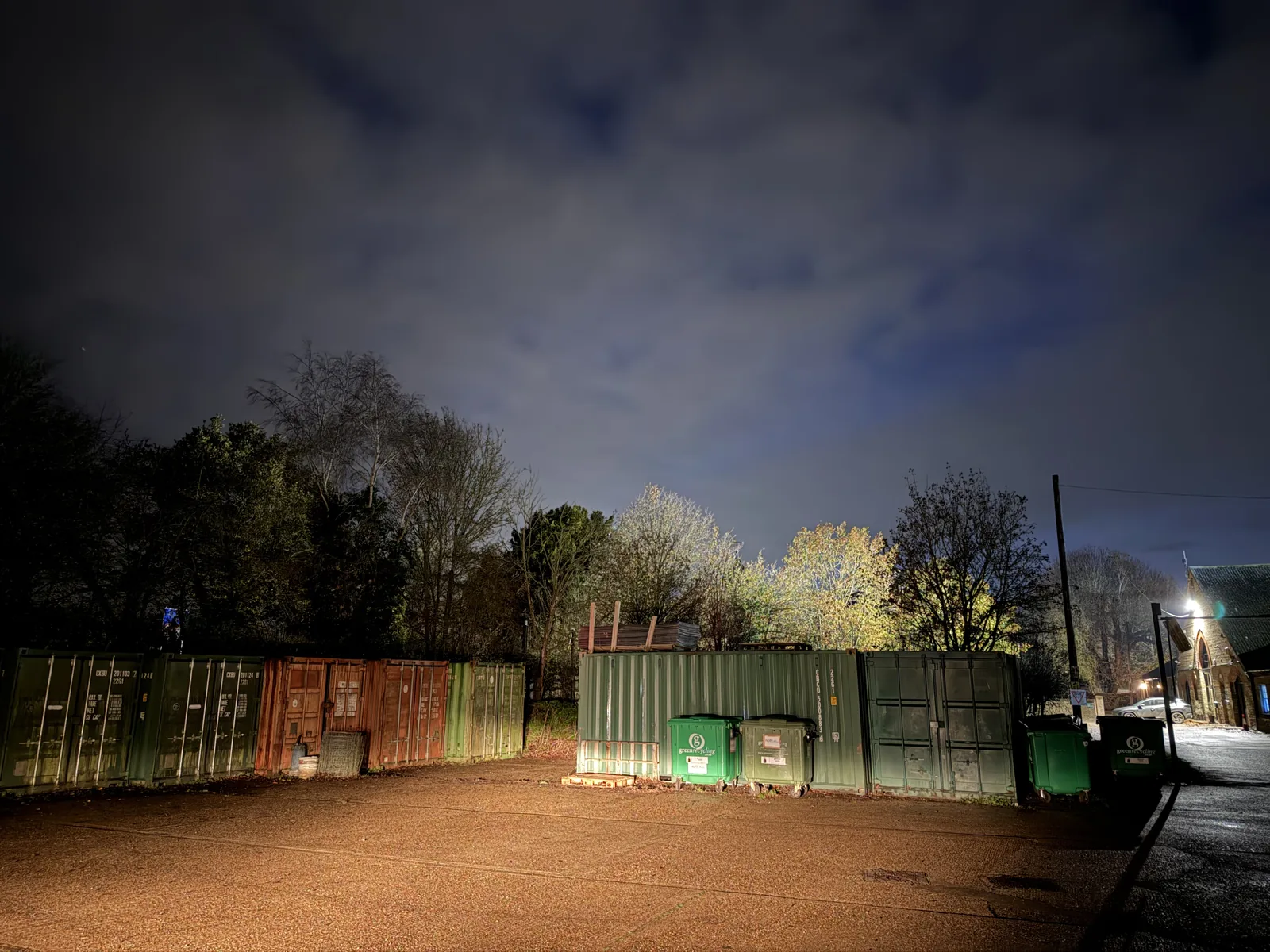 Shipping containers and bins at the reported Little Braxted sighting location at night